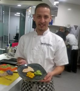 Chef presenting pureed food during a training day