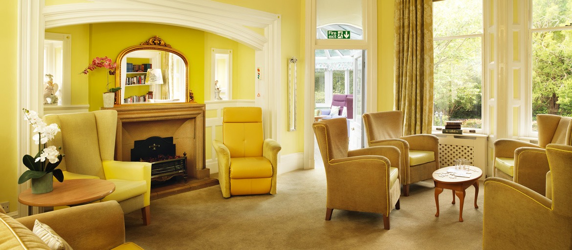 Soft yellow lounge area with comfortable chairs