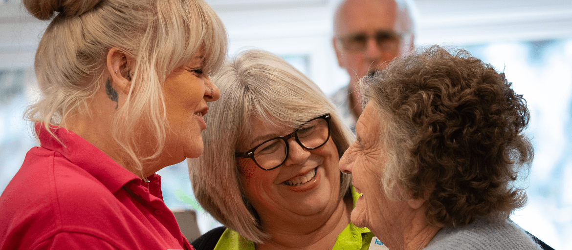 Residents and carers talking together at Hawkhurst House Care Home in Hawkhurst,Cranbrook