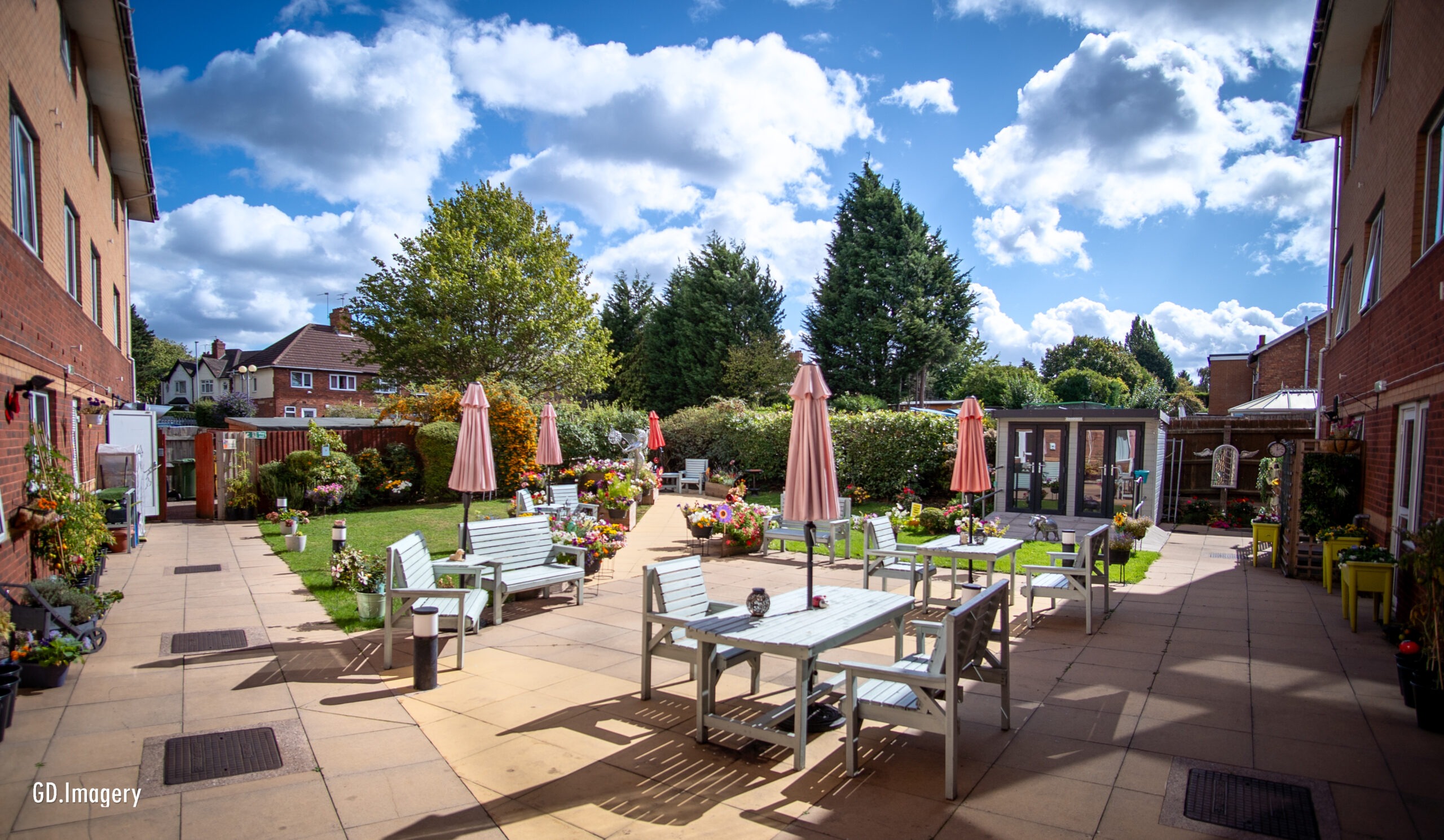 The landscaped garden patio area at Delves Court Care Home